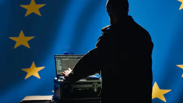 stock image EU alliance military engineer creating fake accounts on social media to persuade other nations to act in member states government interests. European Union soldier influences people online