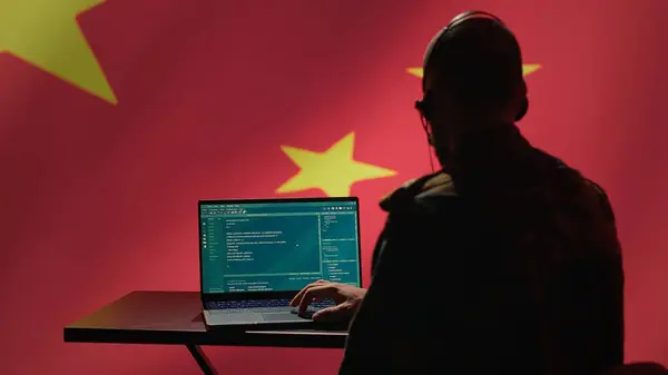 stock image China military engineer creating fake accounts on social media to persuade other nations to act in the Chinese government interests. CCP intelligence operator spreading misinformation online, camera A