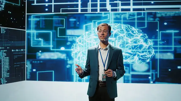 stock image Jolly engineer using artificial intelligence computing simulating human brain thought processes. Portrait of upbeat Indian employee working with AI machine learning algorithms, camera B