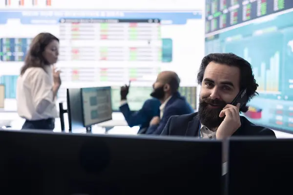 stock image Chairman of the advisory board transmits potential company expansion plans, attends phone call with the supervisor. Looks into data visualizations on a big screen, boost affordable earnings.