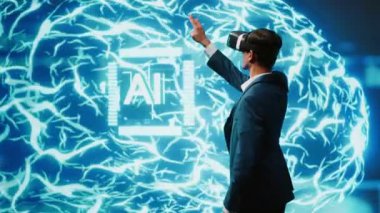VR kulaklık takan bilgisayar bilimcisi insan beyninin yapay zeka simülasyonuna bakıyor. Hintli adam, makine öğrenme algoritmalarını gösteren yapay zeka görselleştirmesi ile etkileşim içinde. Kamera A