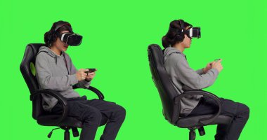 Oyuncu video oyunlarını VR kulaklığıyla seviyor, akıllı telefon uygulamasında sanal gerçeklik gözlükleriyle online oyun yarışması yapıyor. Gençler arkadaşlarıyla eğleniyor, yeşil perde arkaplanı.