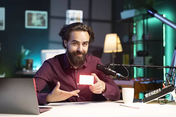 stock image Portrait of smiling tech guru filming technology review of mini led lights, unboxing it for audience. Cheerful internet star showing filming equipment to subscribers, talking in mic