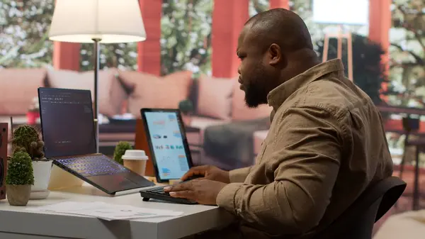 stock image Professional IT engineer at his desk working on AI coding and deep learning projects, showcasing innovation in software development and cloud computing. Internet of things. Camera A.