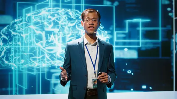 stock image Presenter talking in front of world leading technology specialists and researchers meeting at artificial intelligence conference. Data scientist showcasing latest innovations in AI industry, camera A