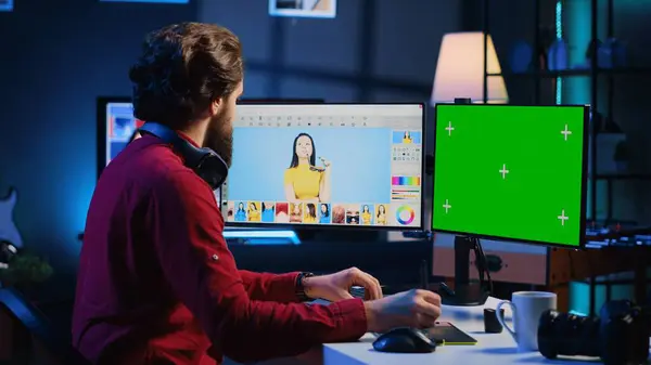 stock image Content specialist using graphic design skills to make social media post on green screen computer for advertising company. Photo editor using chroma key PC monitor to create promotional image