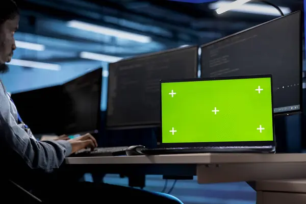 stock image Isolated screen laptop in data center facility managing rackmounts energy consumption. Chroma key notebook used for automation and monitoring processes in server room, close up