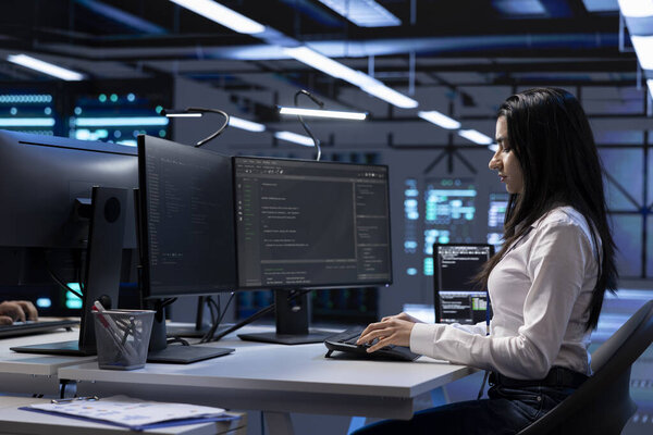 Engineer in data center running system diagnostic tests and error checking utilities to identify and resolve problems. Worker looking for network issues affecting server performance and connectivity