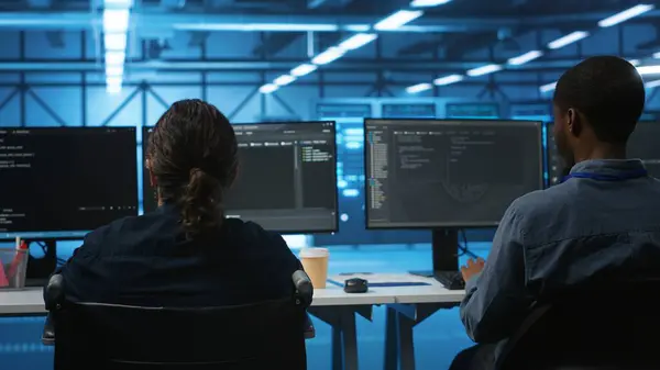 stock image Person with paraplegia working in inclusive workplace typing data on PC, doing needed adjustments in supercomputers server hub housing advanced data storage infrastructure