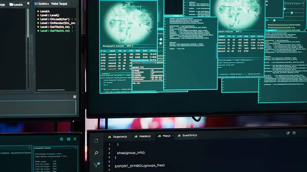 stock image Close up of code running on computer displays in empty apartment used by hacker stealing secrets. Illegal scripts on PC screens used by spy infiltrating governments, handheld camera shot