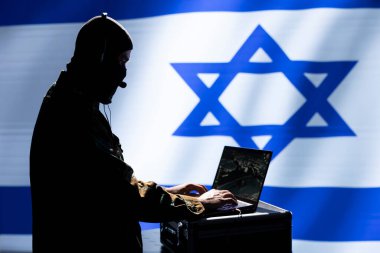 Mossad agent responsible for Israel air defense, relaying instructions to squadrons patrolling over borders. Military counterintelligence department specialist using laptop software to do monitoring clipart