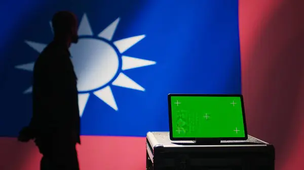 stock image Taiwan army commander devising strategy to combat Chinese propaganda next to green screen tablet. Taiwanese freedom fighter walking in operation room in front of mockup device, camera B