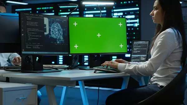 stock image Technician doing checkup on green screen server hub PC to optimize it for data processing requirements of AI. Worker inspects data center used for machine learning using mockup computer, camera A