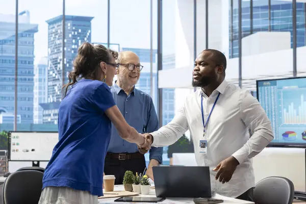 stock image Senior citizens greeting a banker to explore various retirement planning options, ensuring they make informed decisions about their future financial stability. Consulting a financial advisor.