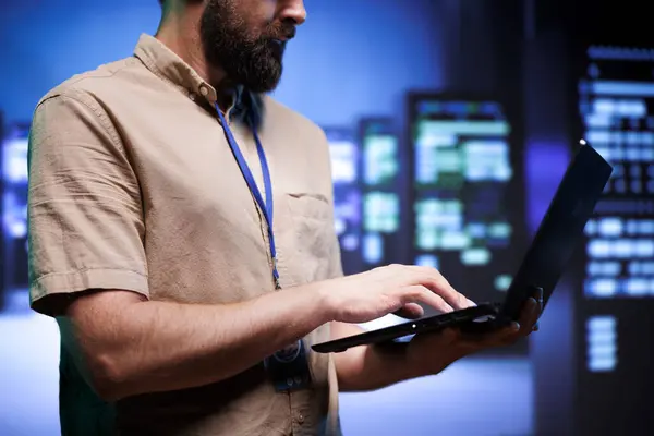 stock image Proficient employee ensuring high tech server hub systems provide redundancy, automatic failover and rapid reconfiguration of clusters to minimize failure of individual machines