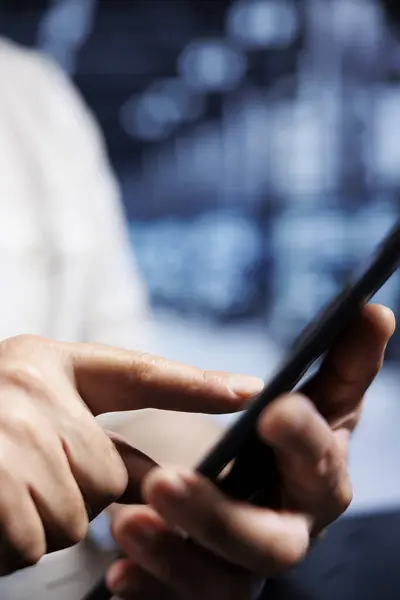 stock image System administrator using tablet in high tech workplace, installing dedicated VPN servers able to provide encrypted sensitive data, online anonymity and fast speed bandwidth to customers, close up