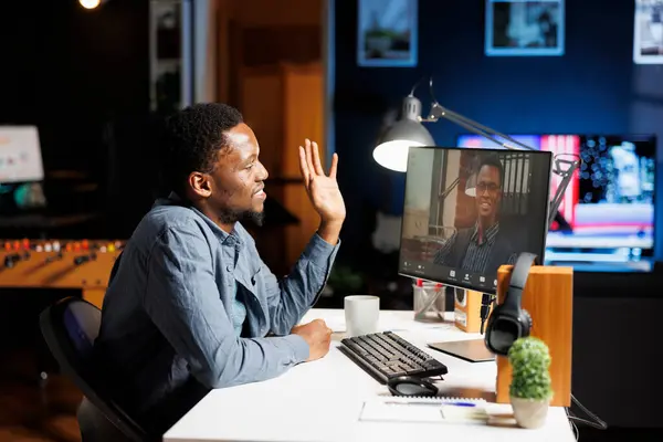 stock image Instructor conducting videoconference training session with newly hired worker, teaching him corporate duties and procedures. Web remote working, trainer and trainee debate their position.