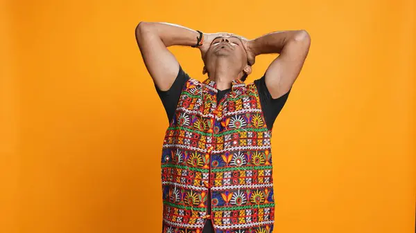 stock image Indian man covering face with palms in disbelief, feeling upset by events, isolated over studio background. Gutted person clawing nails on skin in frustration, irked by troubling news, camera B