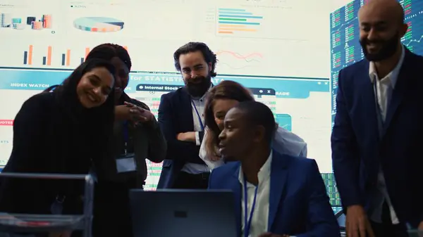 stock image Diverse business employees group celebrate a successful outcome, obtaining more expansion funds and sharing a high five with all the staff members. Pleased workers enjoying success. Camera B.