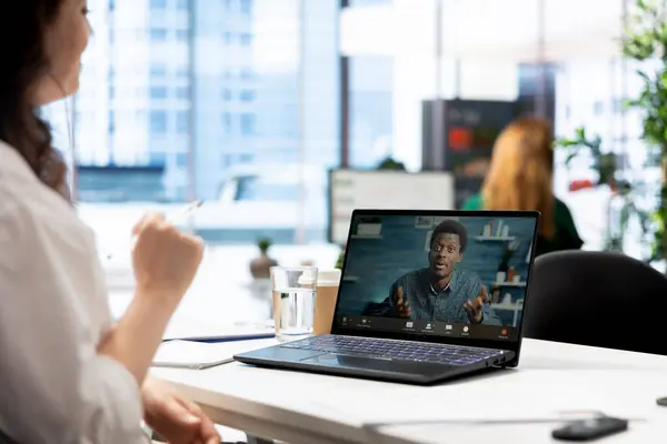 stock image Recruiter in videoconference meeting with man after finding best talent to fill open company position. Employer hired to assess skills of candidate doing remote call in office