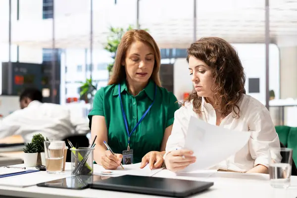 stock image Team of HR workers identifying right candidates for job opening, reviewing resumes to determine candidate qualifications. Teamworking colleagues doing screening process, selecting skilled people