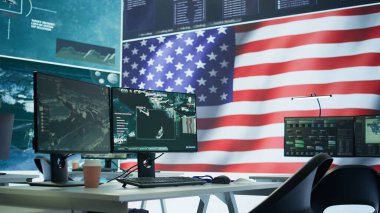 Empty operation room with an American flag running on big screen in control tower, protecting classified information and state secrets. Military command post fights for anti terrorism. Camera B. clipart