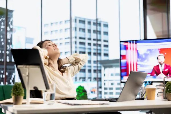 Stock image Woman CEO dealing with muscle cramps due to incorrect posture at the desk, having neck and back ache while she works in her office. Female director with spasm and sedentary life.