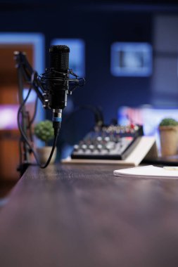 Podcast microphone for live streaming used to record content discussions for internet channels. Closeup of professional mic used for live online talk shows, broadcasted in a home studio. clipart