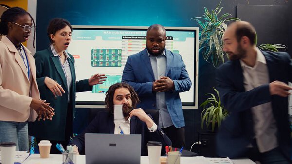 Sick and tired employee throwing the badge in front of the manager, exhausted working under pressure for his mad supervisor. Angry worker quitting his job during a meeting, leaving office. Camera B.