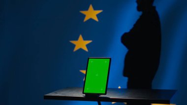 European Union counterintelligence division uses green screen tablet to protect against propaganda affecting elections. EU security service safeguarding democracy online using mockup device, camera A clipart