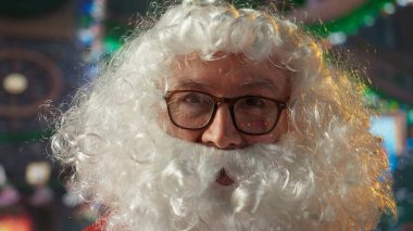 POV of Santa Claus talking to kids around the world on video call online, recording himself at his North Pole log cabin. Old man in red suit preparing for his Christmas eve journey. Camera A. clipart