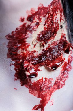 Extreme close up shot of bloody injury on pale neck achieved through professional SFX makeup for horror film scene. Gore scars with fake blood cosmetics, special effects used as Halloween costume clipart