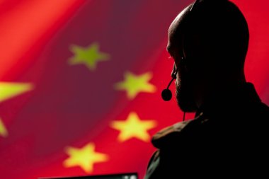 Military dispatcher working for Chinese Communist Party providing informations for troops using headset. Radio communications operator isolated over China flag background coordinating troops clipart