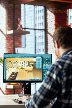 Adam odayı yeniden tasarlamak için iç tasarım uygulaması kullanıyor. Mobilyaların yeni daireye nasıl uyacağını planlıyor. Tasarım uygulamalarını önizlemek için sanal ev dekorasyon yazılımı kullanan profesyonel