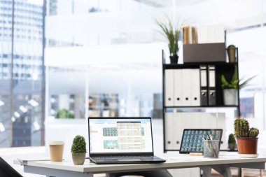 Stock market values going up and down on laptop in empty financial department office, price volatility concept. Forex trading economic analytics figures on notebook screen in workspace clipart