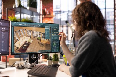 Ev tasarımı uzmanı bir kat planı geliştirmek için mimari yazılım kullanır, dijital araç apartman içlerini hassas mobilya yerleştirmek için sezgisel bir arayüz sunar.