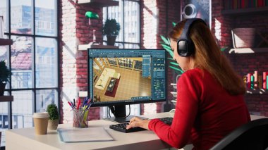 Tasarımcı sanal bir ev seti üretmek için dijital teknolojiyle etkileşime girer. Mimari yazılım 3D modelleme ve hazırlama, mobilya yerleştirme ve yerleşim düzenlemelerini mümkün kılar. Kamera B.