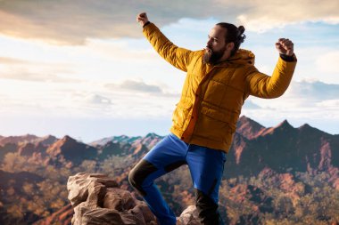 Trekker kollarını dağ sırasının tepesinde heyecan içinde uzatıyor, tırmanma başarısından gurur duyuyor ve tatmin oluyor. Genç yetişkinler azim ve hırslarını sergiler..