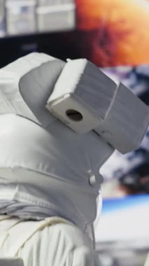 Vertical Video Space man on a cosmic journey mission surrounded by stars and the galaxy, showcasing surreal exploration. Male astronaut with suit and helmet travelling in the universe, outer space