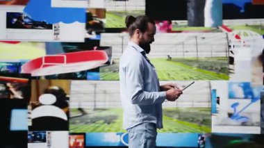 E ticaret uzmanı mobil teknoloji ve kullanıcı arayüzleri tarafından desteklenen dijital bir dünyada medya platformları, sosyal ağ yaratıcılığı ve çevrimiçi bağlantının canlı bir sunumunu yapıyor. Kamera B.