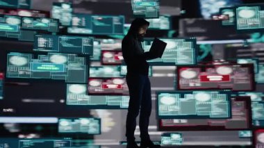 Siber suçun, erkek hacker 'ın sistem savunmasızlığını kullanması, programlama tekniği ve gözetlemeyi kullanarak dijital savunmaları geçersiz kılması ve bilgi sızdırmasıyla kavramsal temsili. Kamera B.