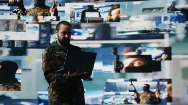 Savunma Kuvvetleri subayı gözetim ve dijital sistemleri inceler, savaş stratejileri ve savaş alanı detaylarıyla savaşa hazırlanır. Askeri kontrol merkezinde savaş planlama operasyonları. Kamera B.