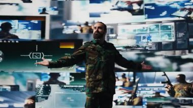 Askeri asker güvenlik kamerası görüntülerinden toplanan verilerle tatmin olmuş, yüksek teknoloji komuta merkezinde taktik operasyonlar üzerinde çalışıyor. Ulusal çıkarları koruyan personel. Kamera B.