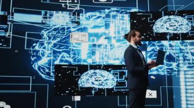 Teknoloji uzmanı yapay zeka araştırmaları ve sanal asistanlar ve veri işleme ile ilgileniyor. Genç mühendis bir sonraki dijital zeka dalgası için robotik ve algoritmik düşünme üzerine çalışıyor. Kamera B.