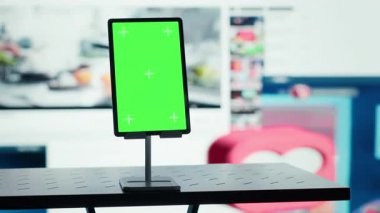 Mockup device and streaming website interface blending viral videos feed. Isolated screen tablet in front of video distribution service layout, concept of promoting on demand content browsing