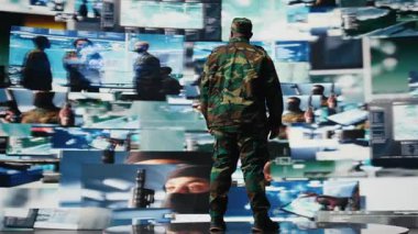 Silahlı kuvvetler subayı istihbarat toplamak için uydu görüntülerini izliyor, savaş planlaması için bilgi topluyor. Afrika kökenli Amerikalı adam görev kontrolünü ve küresel operasyonları destekliyor. Kamera A.