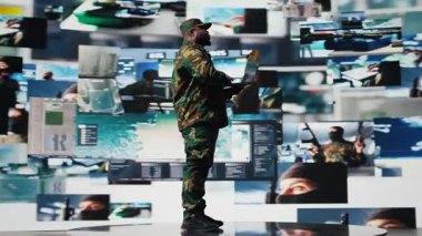 Subay, savaş alanı kontrolü ve stratejik savunma sağlamak için gelişmiş askeri sistemler, siber taktikler ve dijital gözetim kullanarak gerçek zamanlı savaş verilerini izliyor. Savaş planlaması. Kamera A.