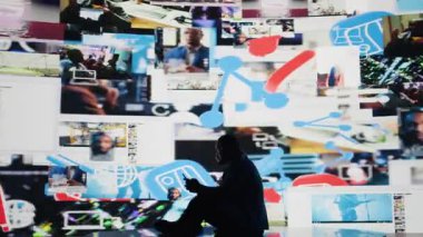 Aşırı bilgi yüklenmesinden kaynaklanan sosyal kaygıları sembolize eden Afrikalı Amerikalı bir adam, çevrimiçi içerik ve cep telefonu kullanımının ezici etkisinden muzdarip. Akıl sağlığı sorunları. Kamera A.