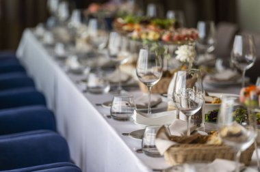 served table in a restaurant for receiving guests, serving dishes for visitors at a holiday at a large table
