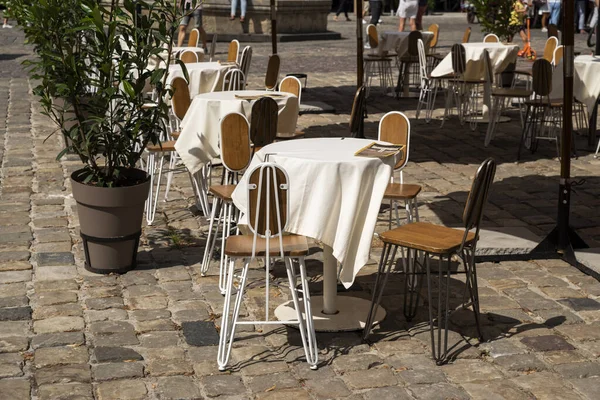 stock image tables and chairs, outdoor furniture for restaurants on a sunny day